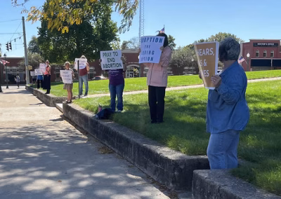 Life Chain people holding proLife signs