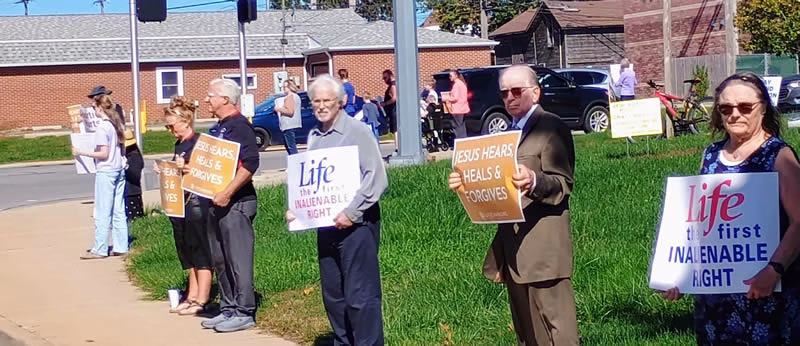 Life Chain people holding proLife signs